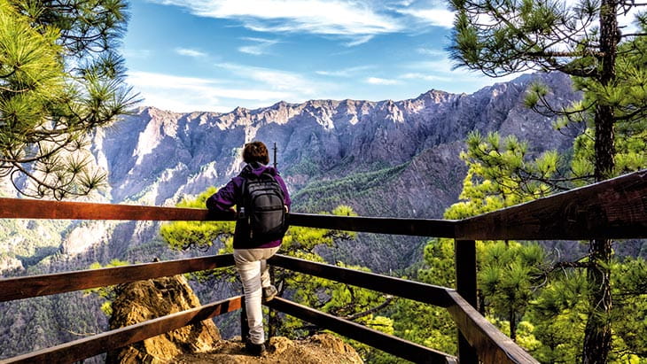 A woman admiring the scenery in the Caldera de Taburiente National Park, La Palma